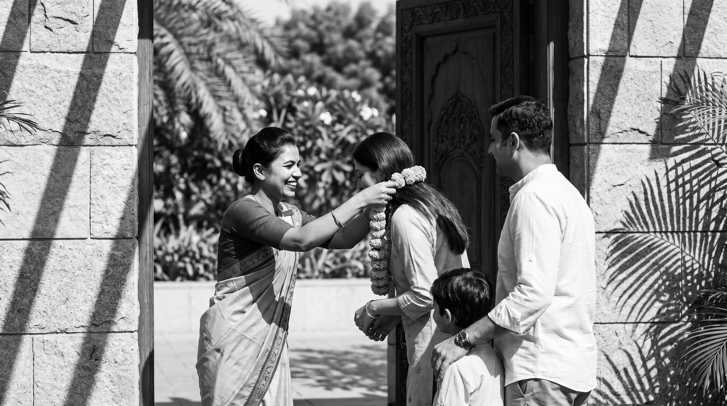 Staff greeting an arriving family at the gate